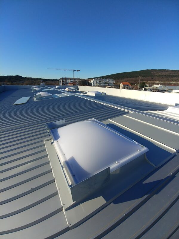 Rectangular skylight dome on an industrial metal roof